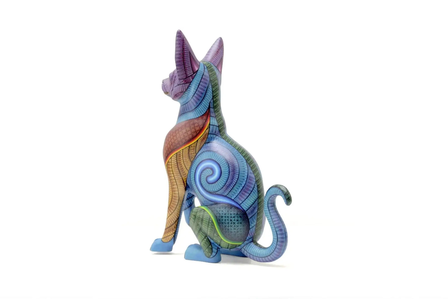 Colorful hand-painted hunting dog alebrije with intricate patterns, symbolizing protection and instinct in Mexican folk art, displayed under natural light with tropical plant shadows