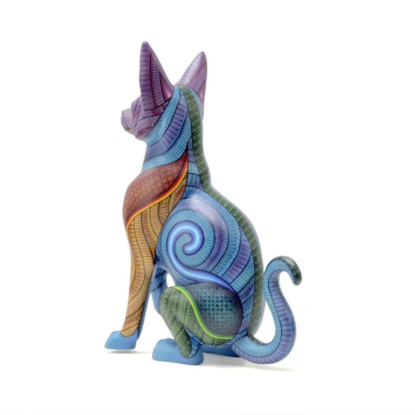 Colorful hand-painted hunting dog alebrije with intricate patterns, symbolizing protection and instinct in Mexican folk art, displayed under natural light with tropical plant shadows