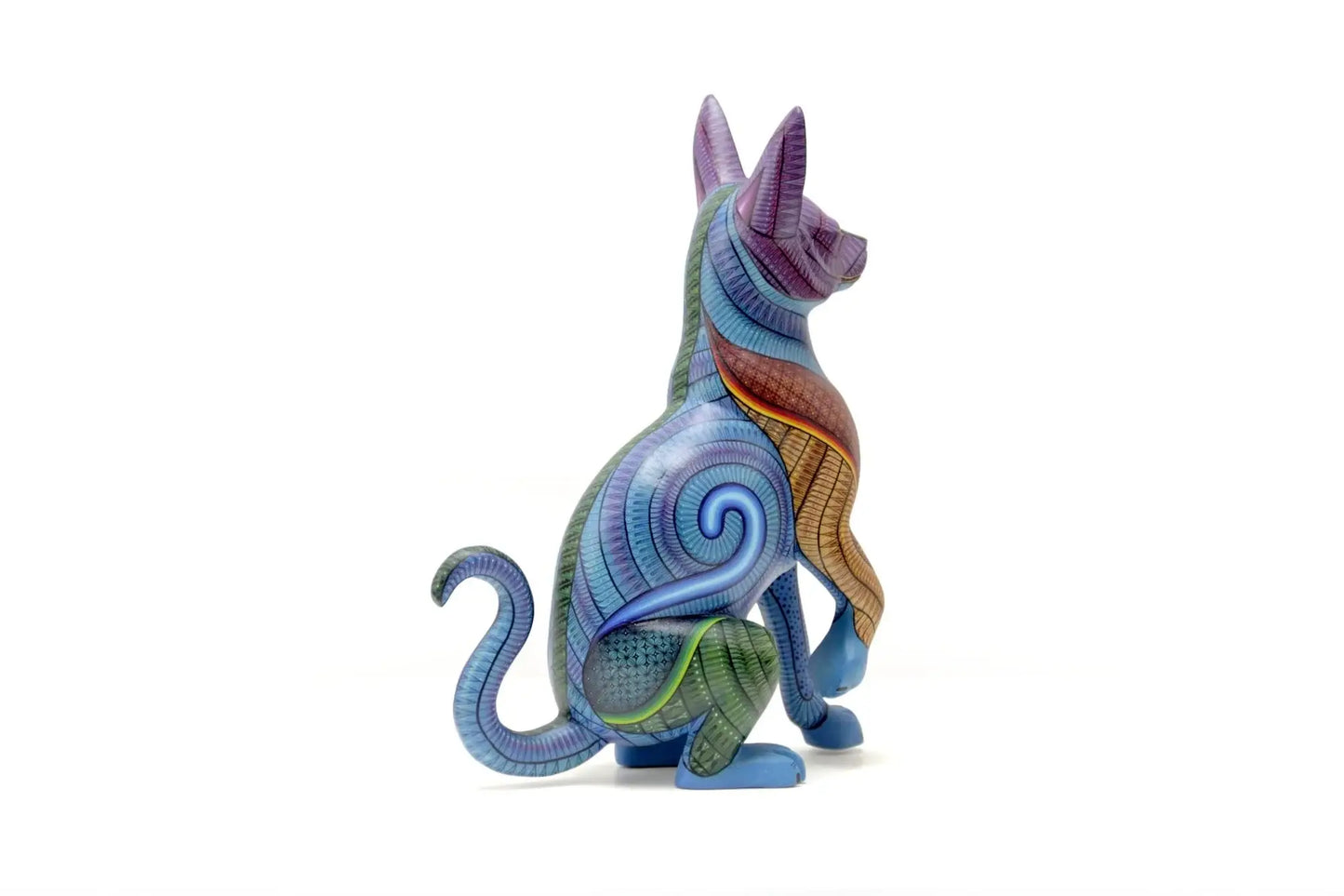 Colorful hand-painted hunting dog alebrije with intricate patterns, symbolizing protection and instinct in Mexican folk art, displayed under natural light with tropical plant shadows