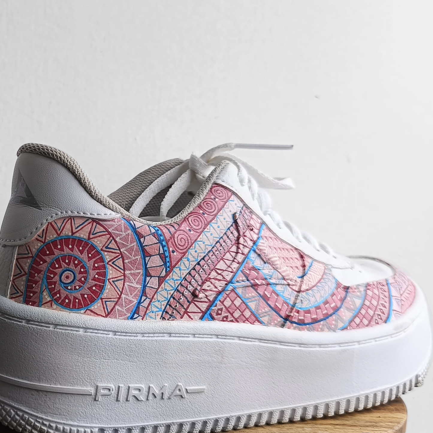 handpainted sneakers with alebrije patterns