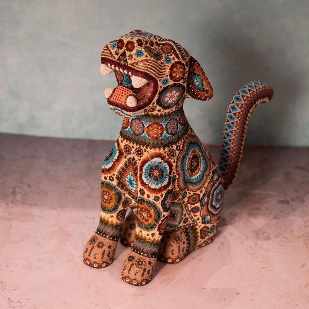 handcarved jaguar sculpture decorated with authentic huichol art, wixarika beadwork made in mexico