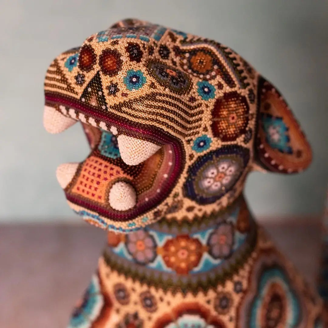 handcarved jaguar sculpture decorated with authentic huichol art, wixarika beadwork made in mexico