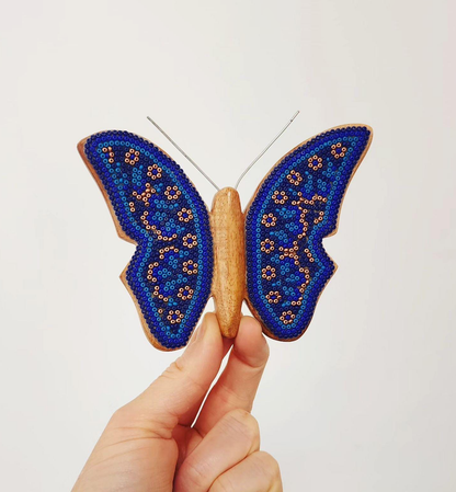 Wooden butterfly figurine with beads