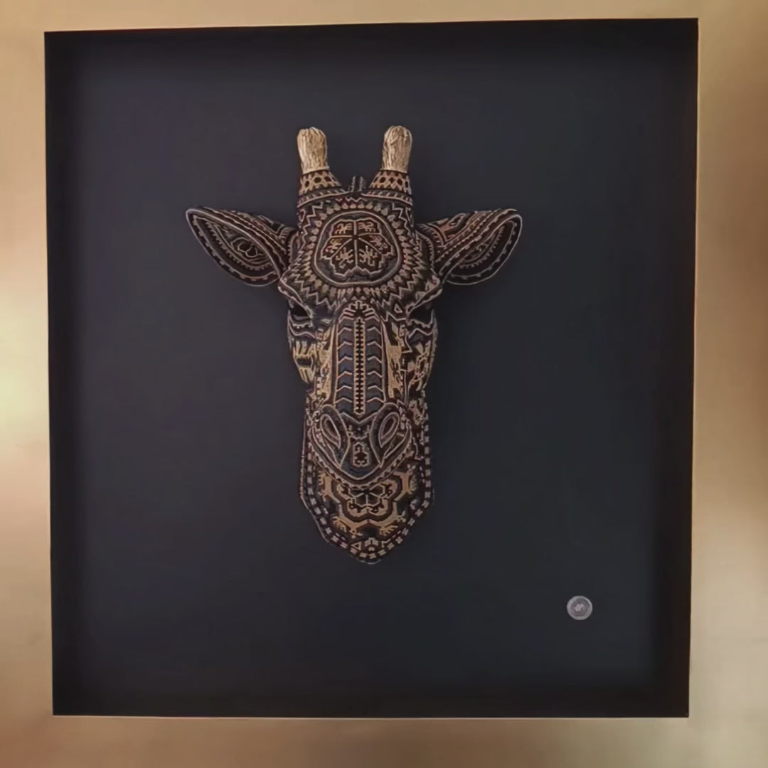 Framed Giraffe artwork with huichol art